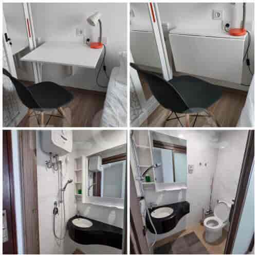 A compact living space with a fold-down desk and chair, showcasing a minimalist design.