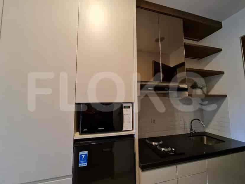 A closer look at the kitchen appliances and storage.