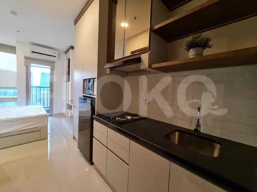 A modern kitchen featuring integrated appliances and a minimalist design.