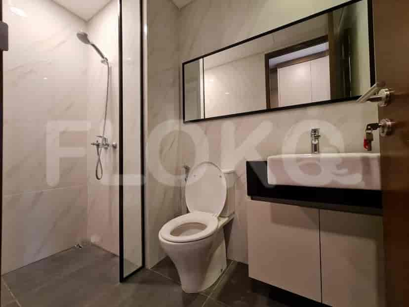 A modern bathroom with a walk-in shower and contemporary fixtures.