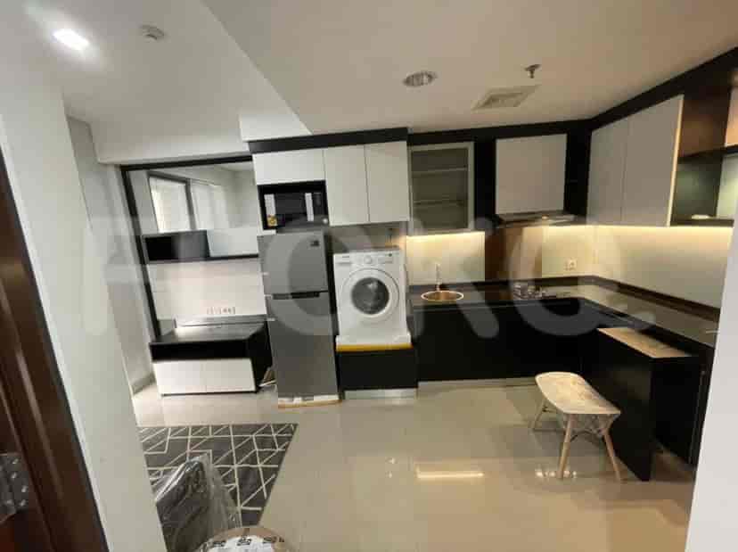 Modern kitchen with appliances and washing machine.