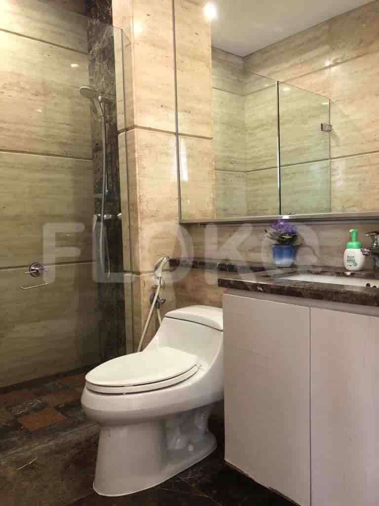A modern bathroom with a glass shower.