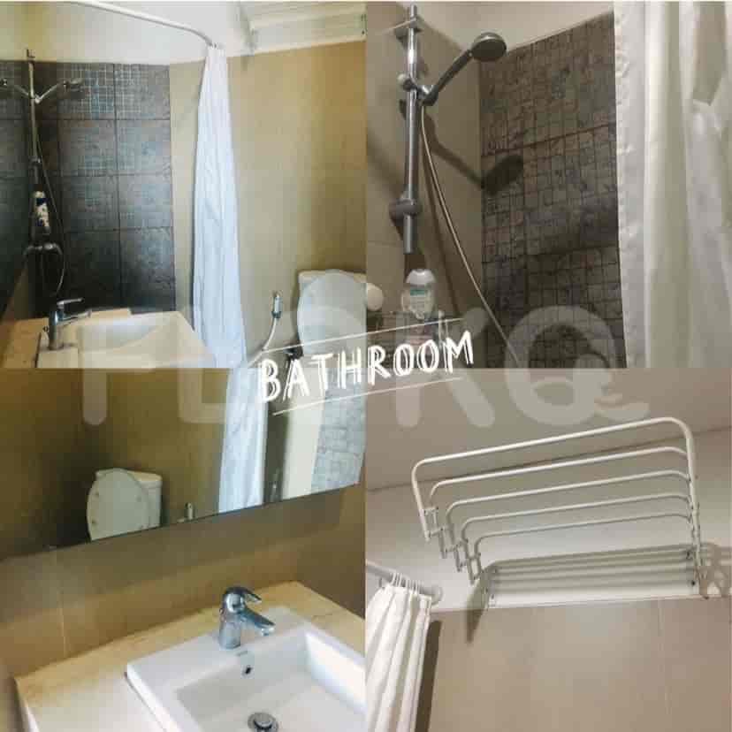 Bathroom with a shower, sink, and towel rack.