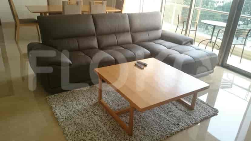Living room with a sofa, coffee table, and area rug.