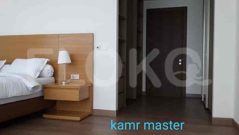 Bedroom with a bed and bedside table.