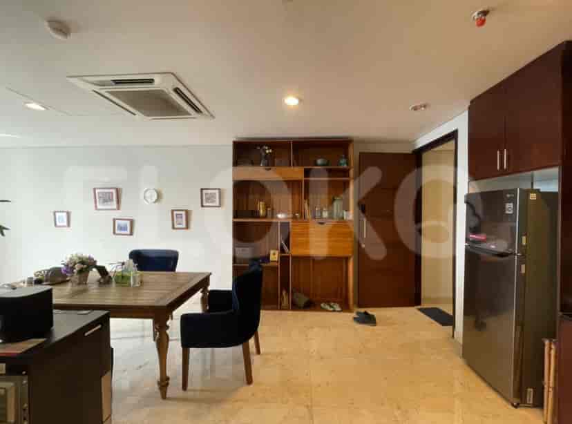 Living and dining area with built-in storage.