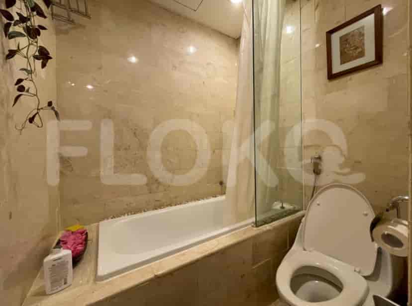 Bathroom with bathtub, shower, and toilet.