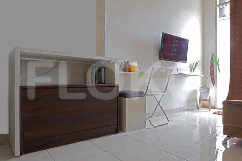 Living area with a study setup.