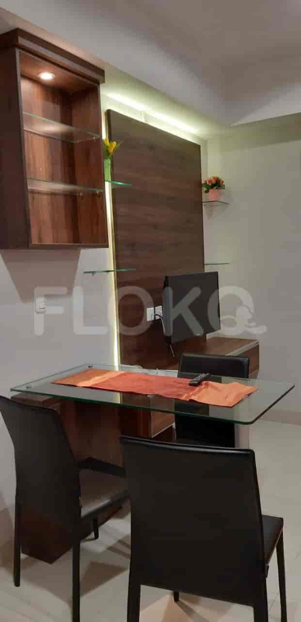 Living room with a table and tv.