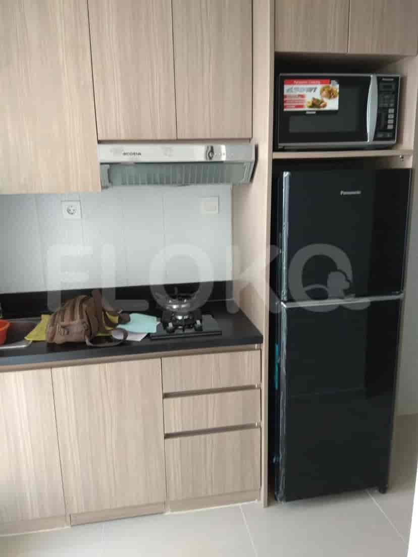 A kitchen with cabinets, appliances, and a stove.