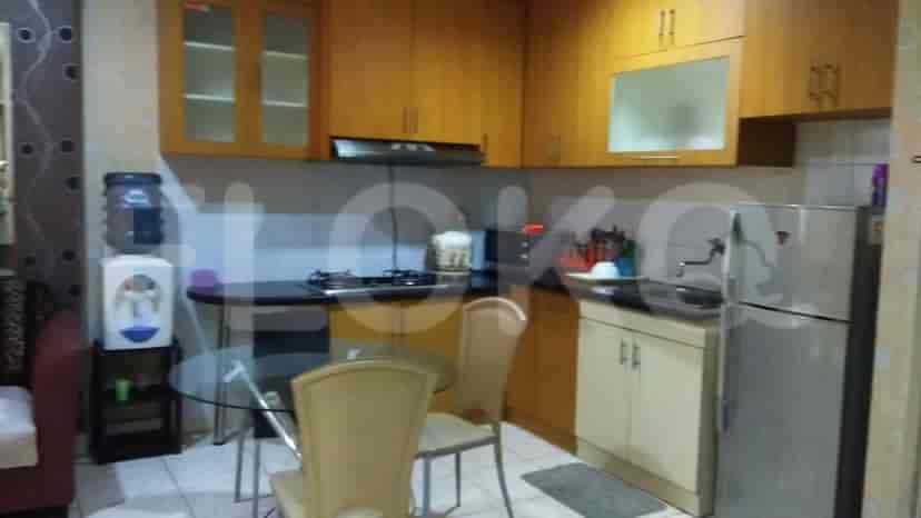 Kitchen with cabinets, stove, and refrigerator.