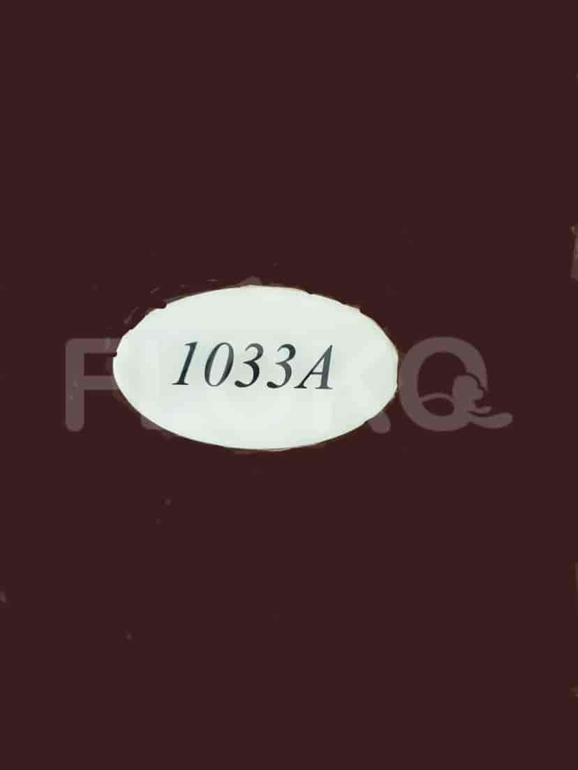 An identifying plate with the property number 1033A.