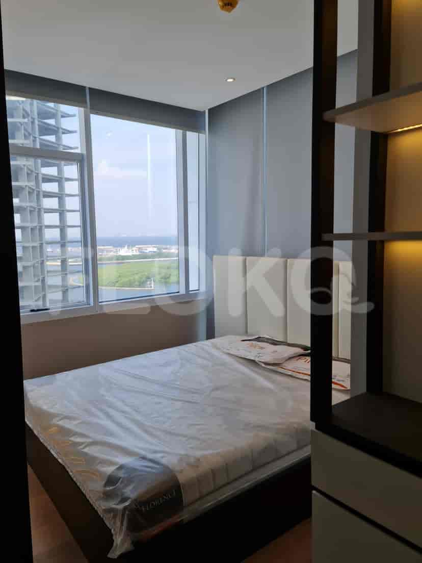 Cozy bedroom with a bed, window, and a view.