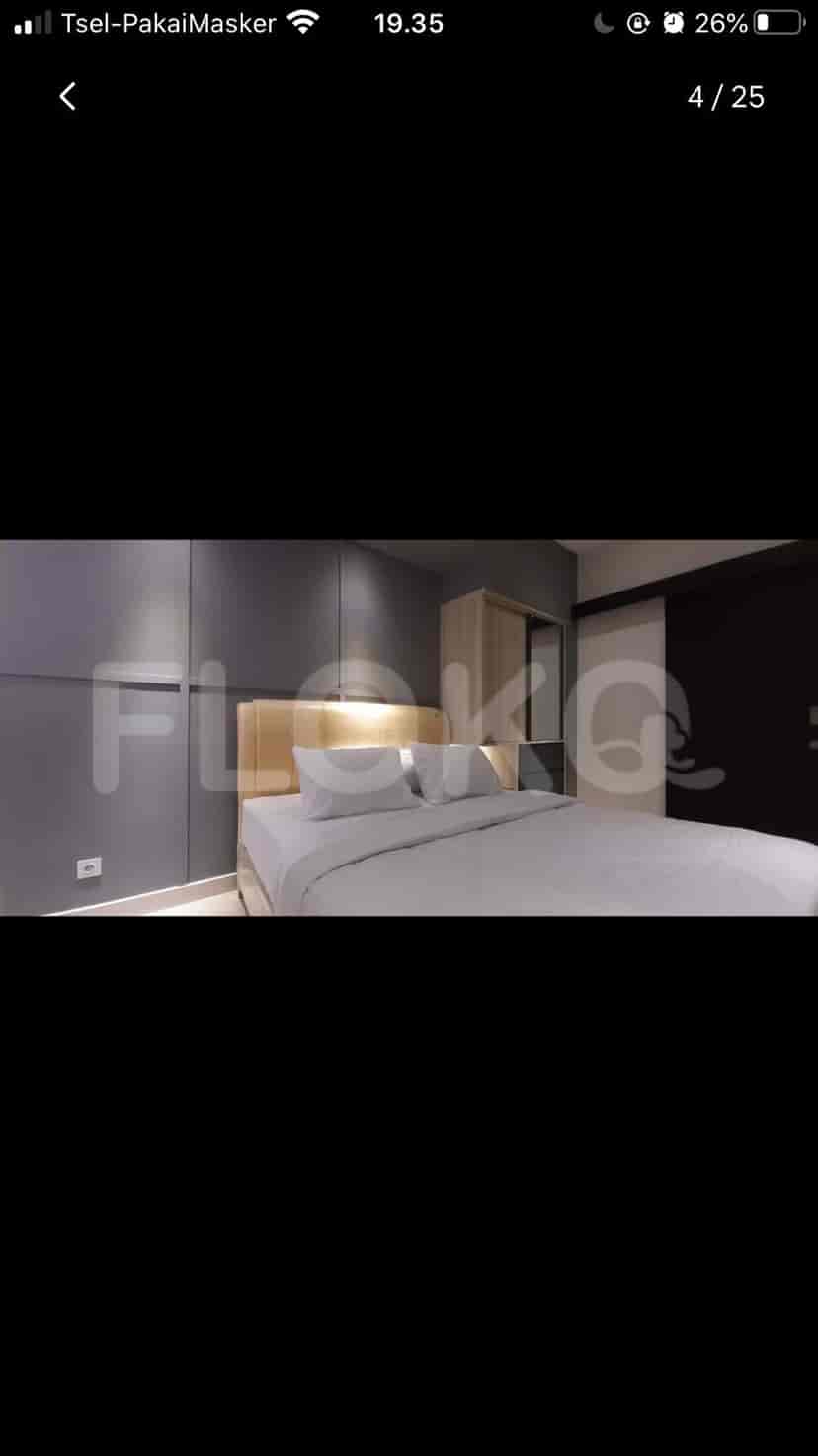 Bedroom with a double bed and artwork.