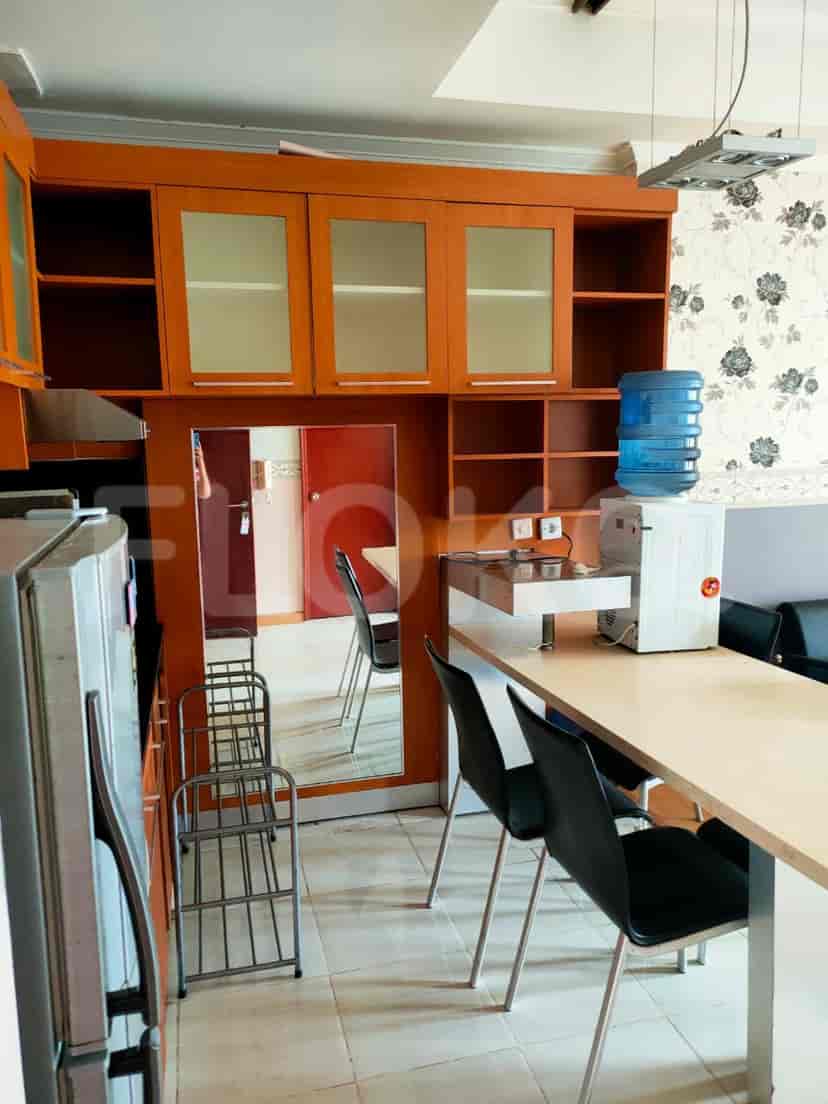 Kitchen with cabinets and dining area.