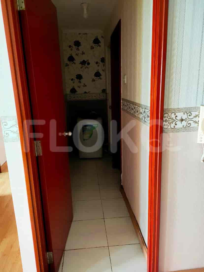 Hallway with a washing machine visible.