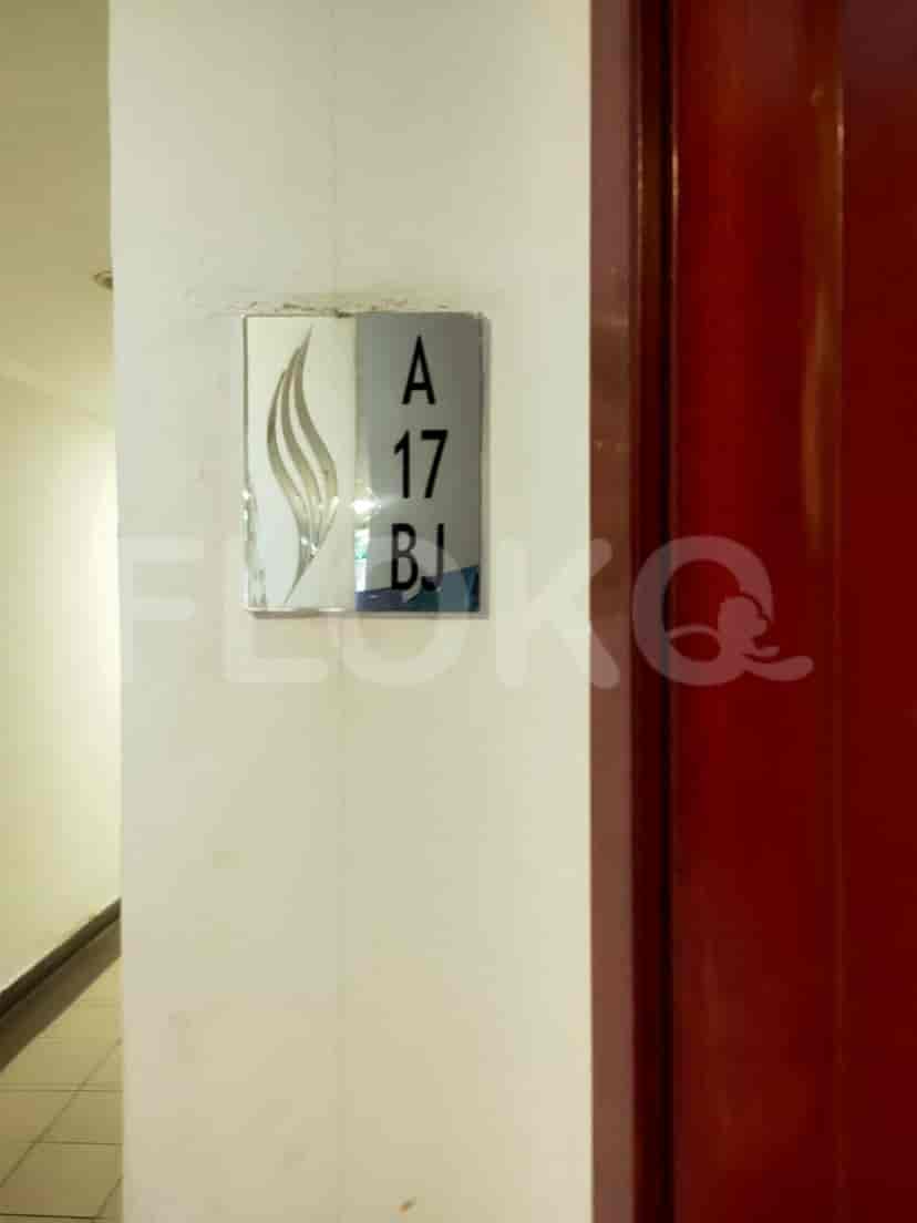Apartment entry with a sign.