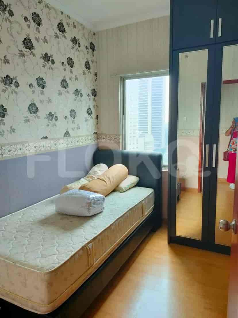 Bedroom with a bed and city view.