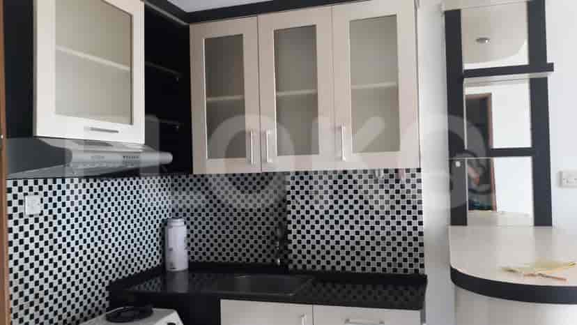 A detailed view of the kitchen with cabinets and appliances.