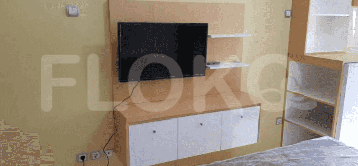 Wall mounted tv and a shelf