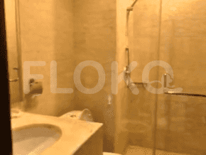 A bathroom with a shower and a sink.
