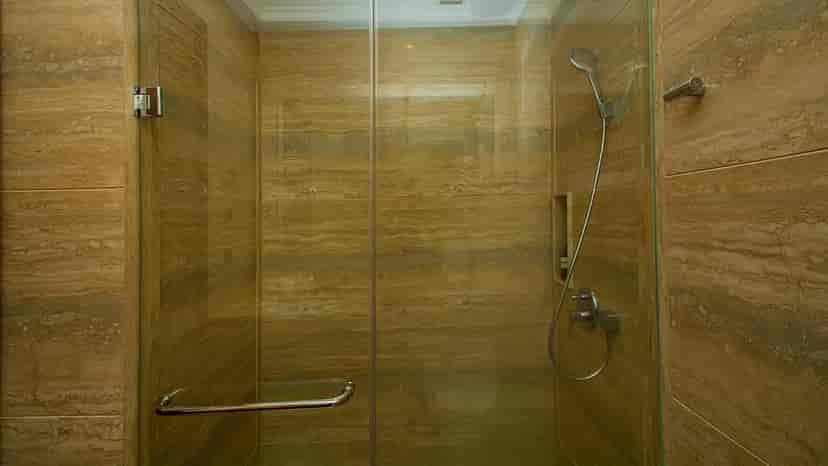 A shower with a glass enclosure.