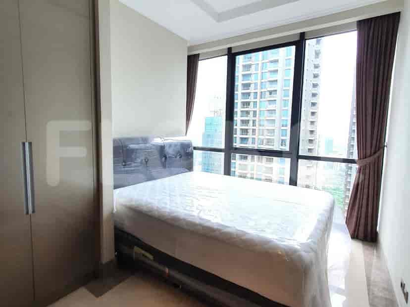 Bedroom with a bed, large windows, and a city view.