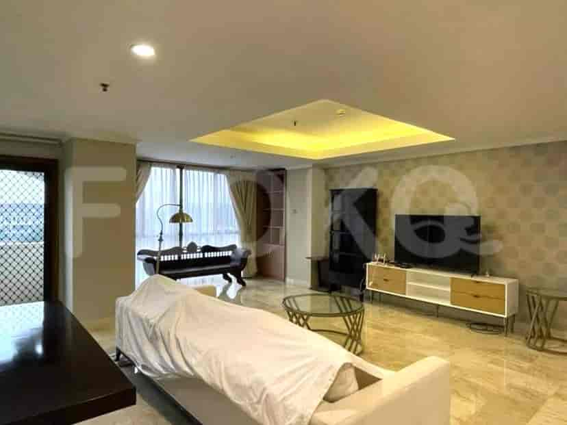 An expansive living room with modern furnishings and a city view.