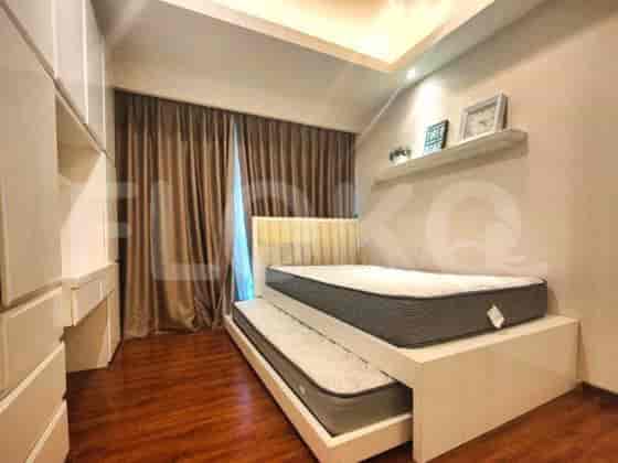A guest bedroom featuring a pull-out bed and storage.