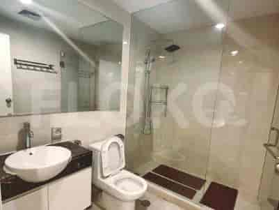 A modern bathroom with a glass shower and contemporary fixtures.