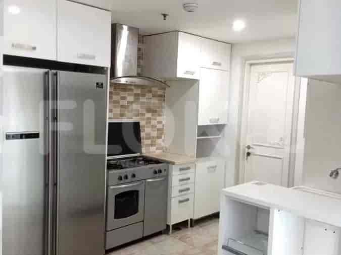 A modern kitchen with stainless steel appliances.