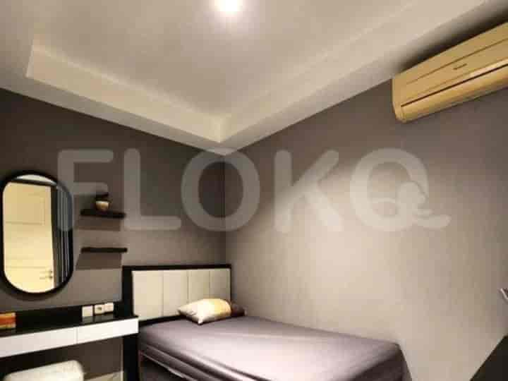 A modern bedroom with a single bed, a vanity table, and grey walls.