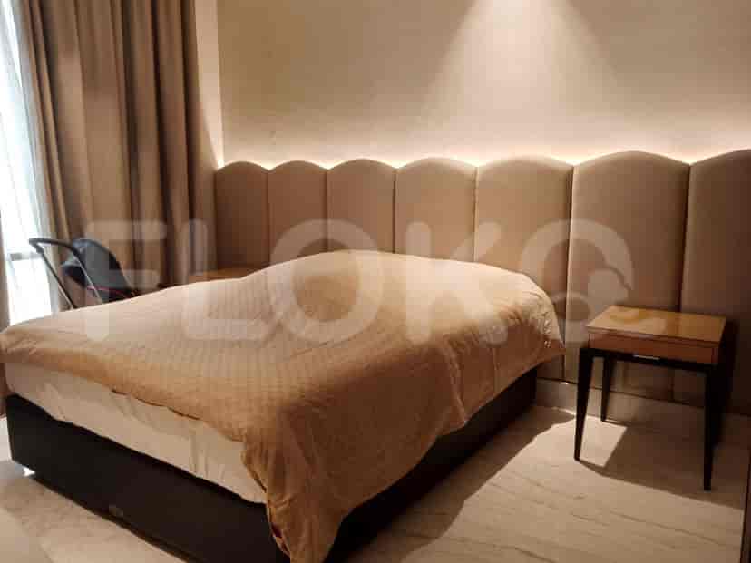 Bedroom with a bed and nightstand.