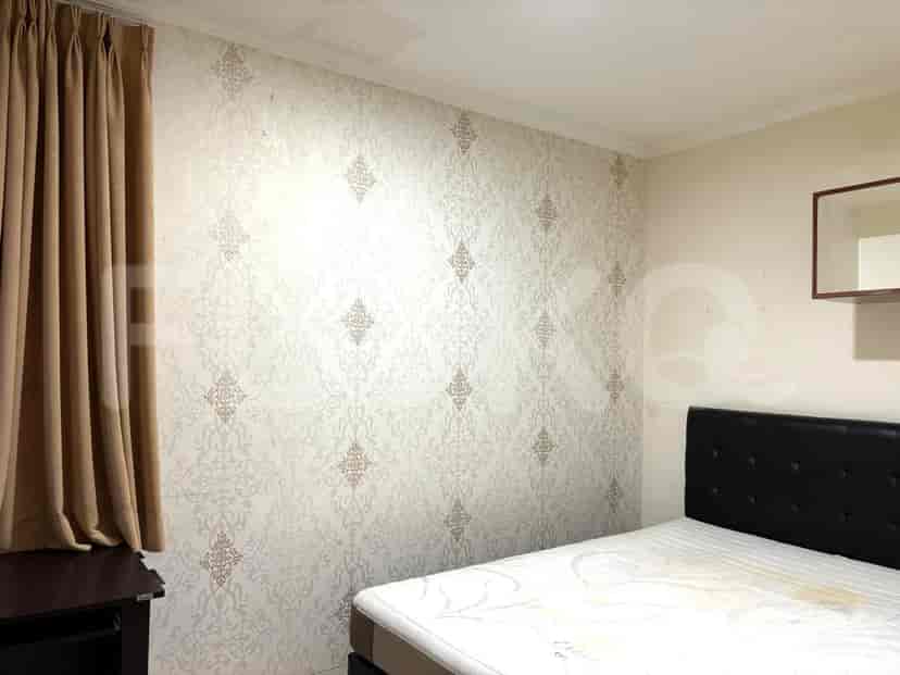 Another view of a bedroom with a bed.