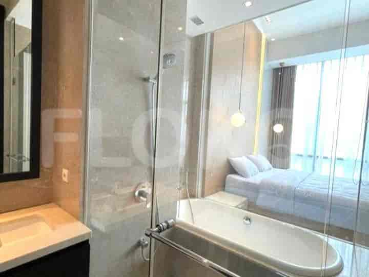 Modern bathroom with bathtub and glass shower.