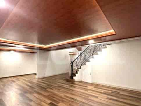 A view of the hallway on the second floor with a decorative railing.