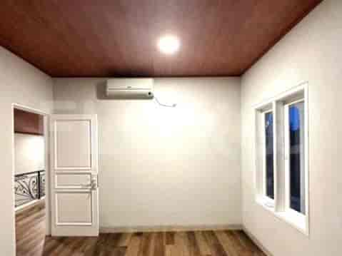 A bathroom with marble effect wall tiles and modern fixtures.