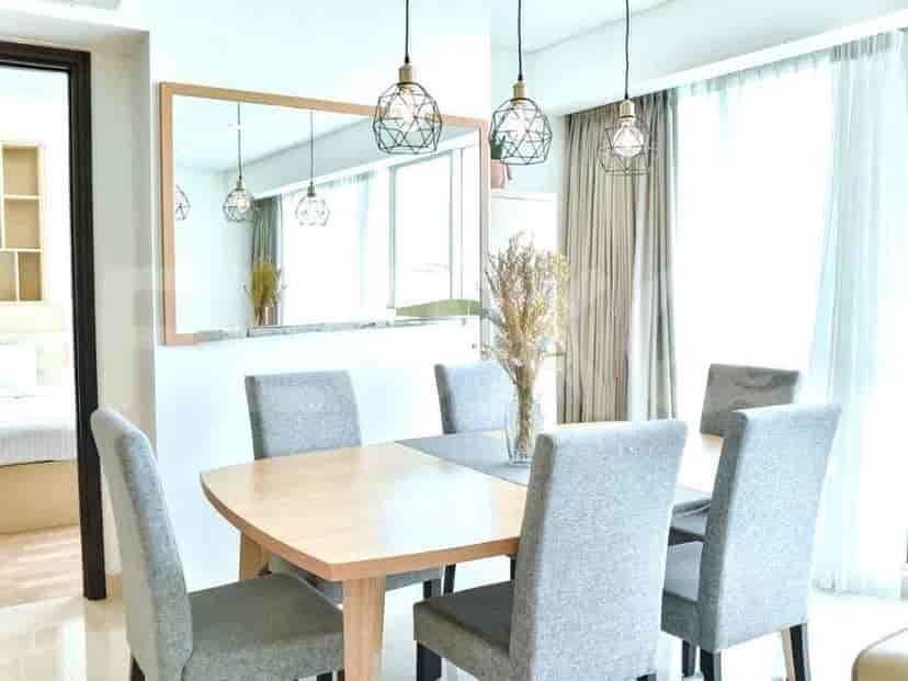 Dining area with a wooden table and chairs.