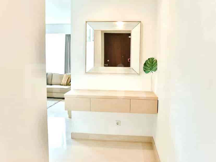 Entryway with a console table and mirror.