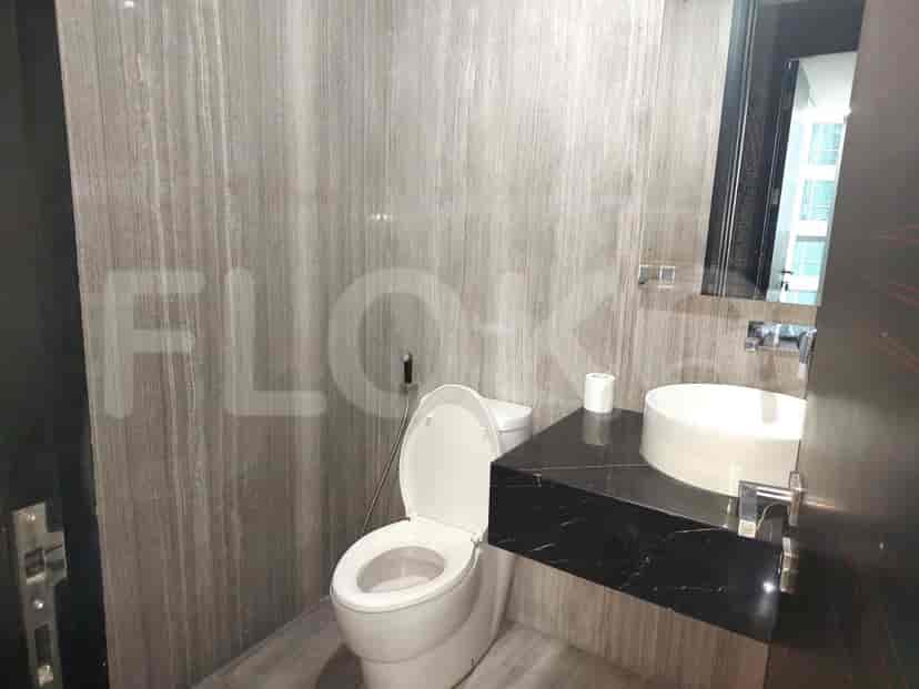A stylish bathroom with a toilet and sink.