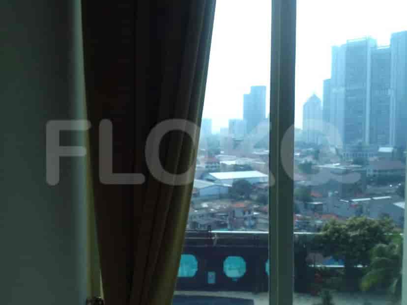 View from window with cityscape.