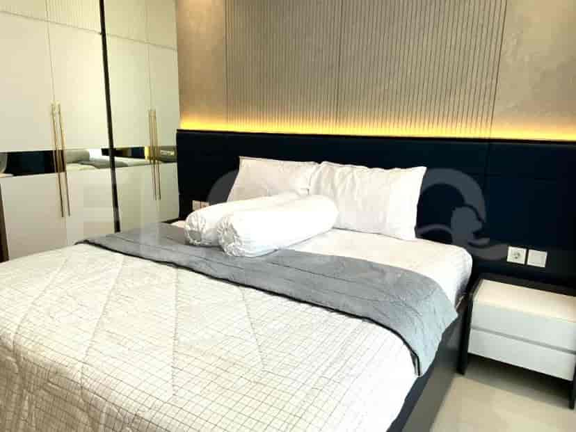 Bedroom with a double bed and a large wardrobe.