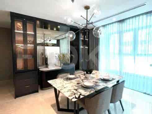 Dining area with a marble table, modern chandelier, and built-in storage.