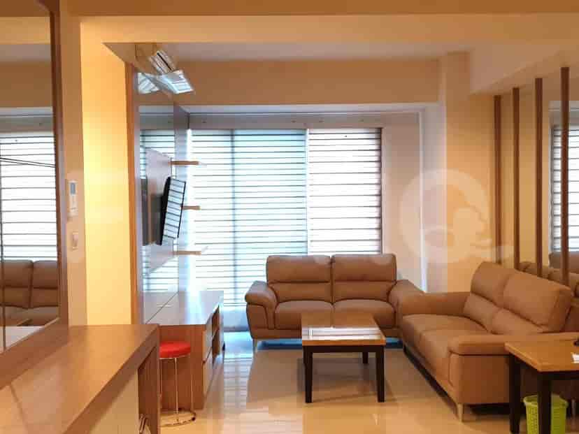 Combined living and dining area with a table setting.