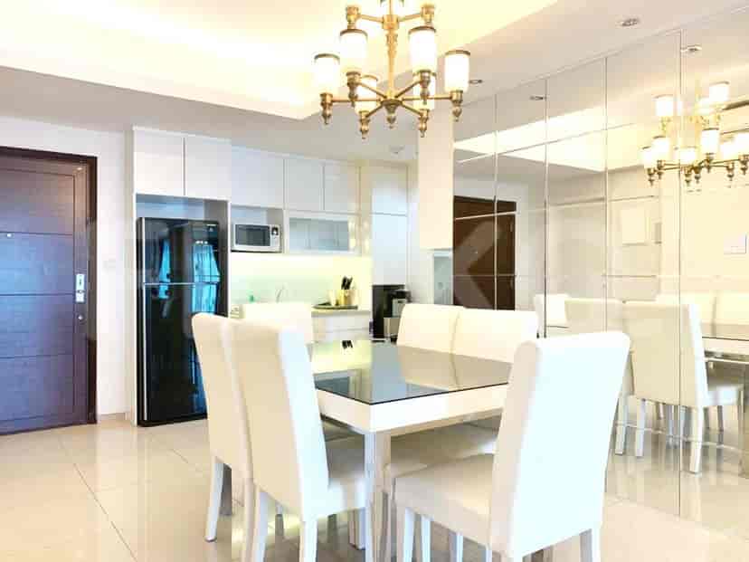 A bright and spacious dining room with an open kitchen concept.