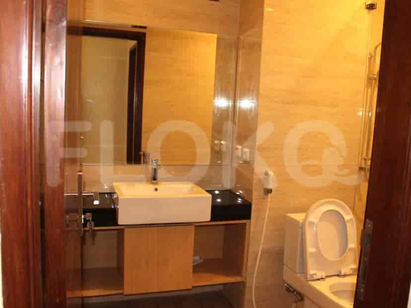 A bathroom with a toilet and sink.