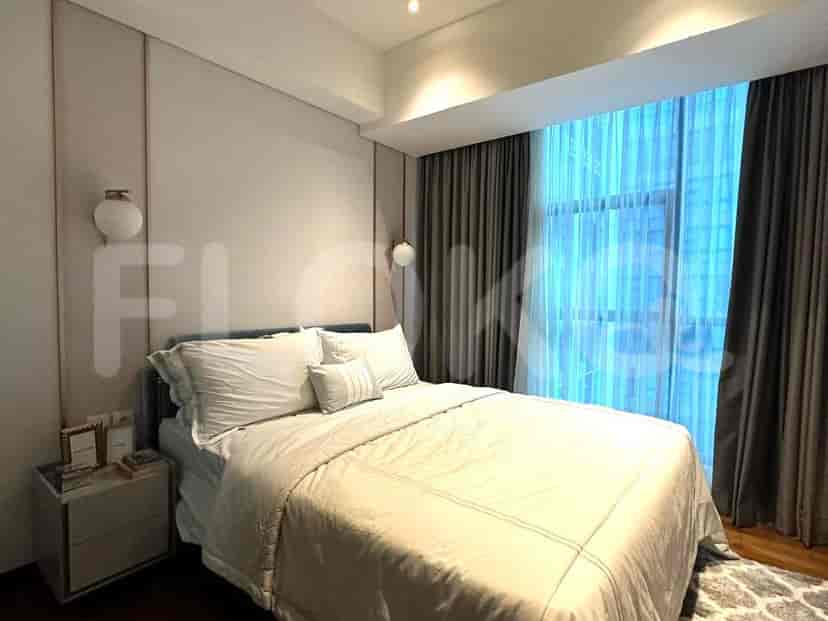 Bedroom with a bed, nightstands, and minimalistic decor.