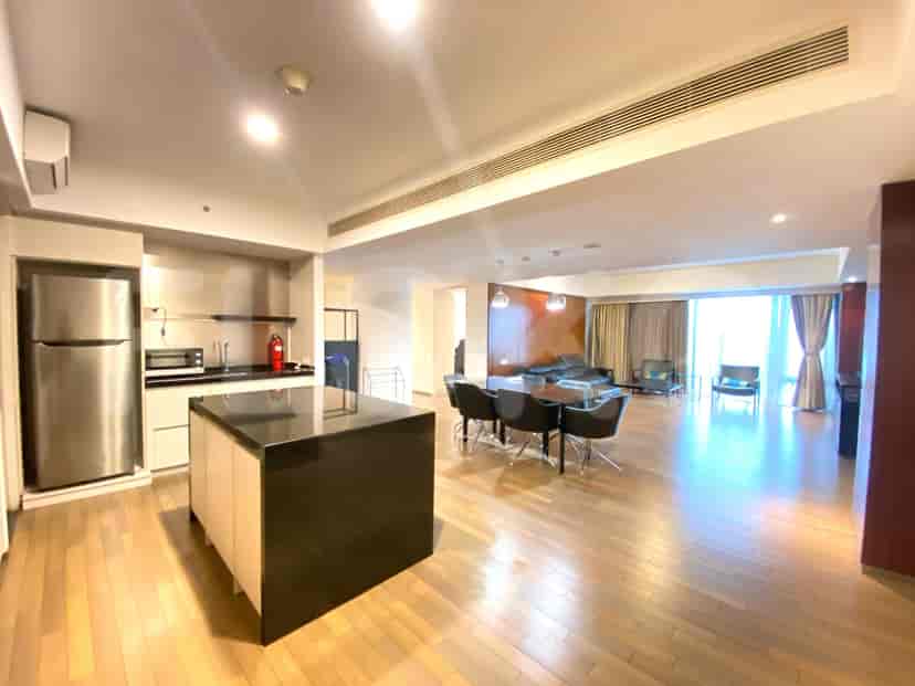 Open space with kitchen, dining, and living areas.