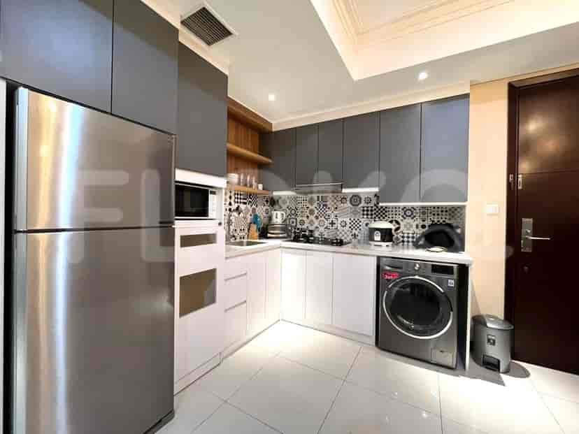 A modern kitchen with stainless steel appliances and stylish cabinetry.
