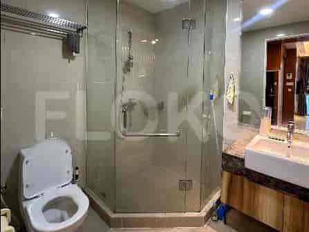 A bathroom with a shower and toilet.